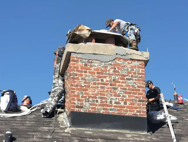 Lehigh Acres Chimney Sweep installing a custom chimney crown in Lehigh Acres, FL