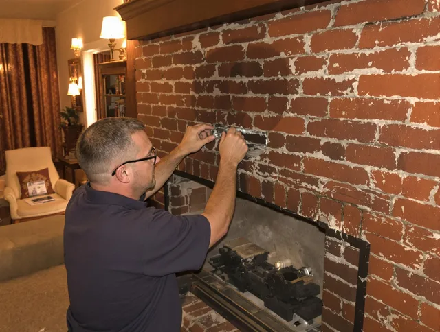 Lehigh Acres Chimney Sweep expert fixing a fireplace in Lehigh Acres, FL
